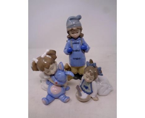 A Nao figure, travelling girl, together with two further Nao figures, toddler with plate and toddler with soft toy  