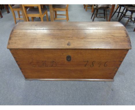 A 19th century oak dome topped shipping trunk, width 124 cm 