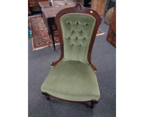 A 19th century mahogany framed lady's chair upholstered in a green button dralon 