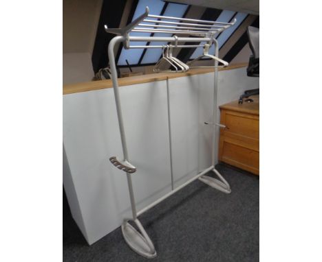 A 20th century metal clothes rail fitted with shelf and umbrella stand 