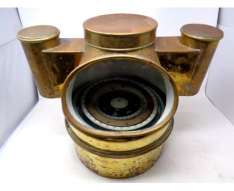 A ship's compass in a brass binnacle 