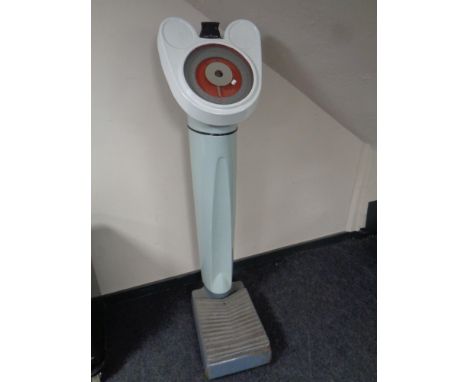 A set of 1930s enamelled coin operated scales  