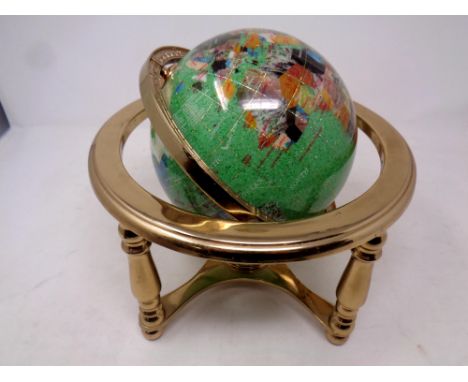 A gemstone globe on stand 