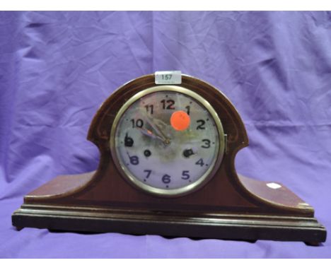 An inlaid wooden mantel clock
