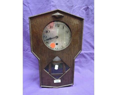 A wood framed wall clock