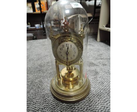An anniversary clock having glass dome and skeleton body