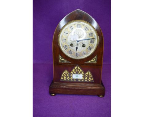 An impressive late Victorian bracket clock in a bishops hat design having a French movement