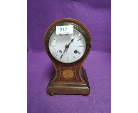 An early 20th century balloon clock having inlaid detail to front,AF.