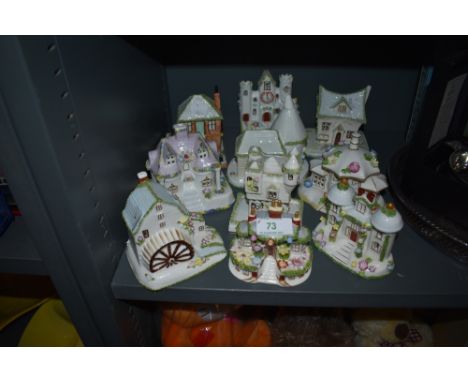 Ten ceramic model figure studies of cottages and buildings by Coalport all in fine condition