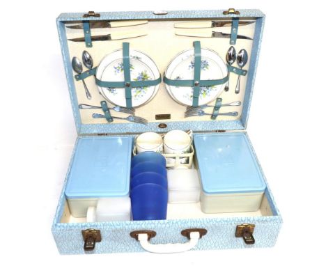 A 1950s Brexton Picnic Set, model no.7908, with a blue case containing original plastic food boxes with lids, two plastic bot