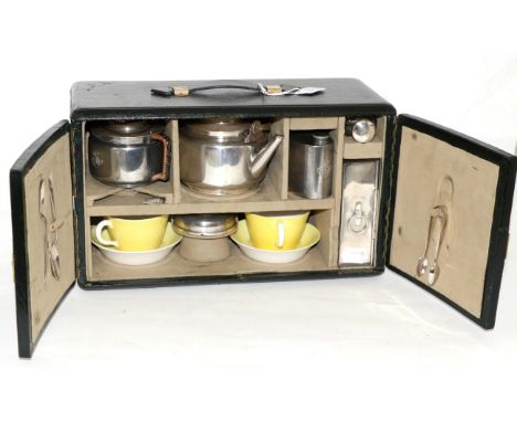 A Vintage Black Leather Picnic Set, early 20th century, with later carrying handle, two cupboard doors enclosing a velvet lin