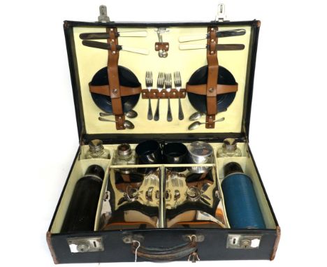 A Sirram Black Leather Picnic Case, early 20th century, comprising two chrome plated food boxes, two ribbed flasks, eight Sir