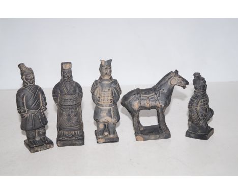 Collection of oriental figures possibly made out of clay