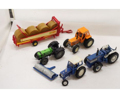 SIX BRITAINS MODELS TO INCLUDE A FORD TW-35 TRACTOR, A FORD 6600 TRACTOR, AN ORANGE TRACTOR, DX110 TRACTOR, A KRONE BENAC RBR