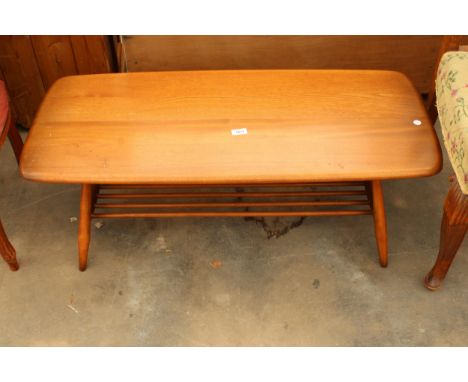 AN ERCOL COFFEE TABLE WITH MAGAZINE SHELF 40" X 18"