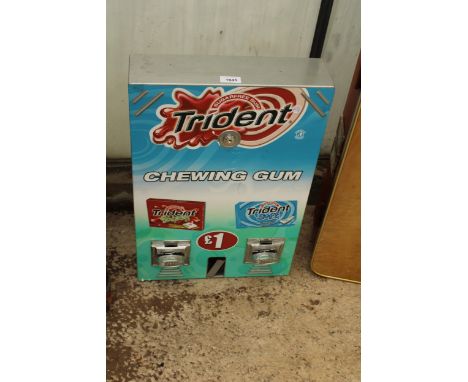 A WALL MOUNTED TRIDENT CHEWING GUM DISPENSER