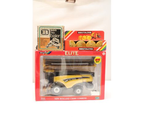 THREE BRITAINS 1:32 SCALE MODELS TO INCLUDE A NEW HOLLAND CX880 COMBINE HARVESTER, A HAY BALER AND ROUND HAY BALES - ALL AS N