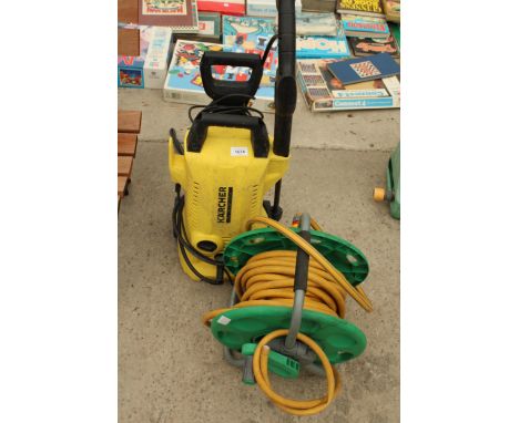 A KARCHER ELECTRIC PRESSURE WASHER AND A HOSE PIPE