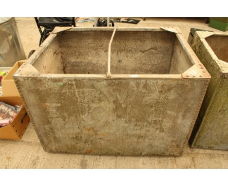 A LARGE VINTAGE GALVANISED RIVETED TROUGH