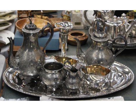 A SILVER PLATE TRAY, TEAPOT, COFFEE POT, MILK, SUGAR PLUS CANDLESTICK