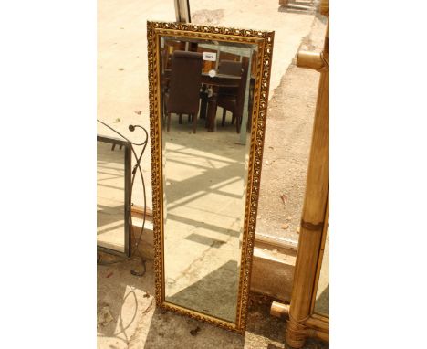 A GLOBE BRAND GILT FRAMED WALL MIRROR, 43" X 15"