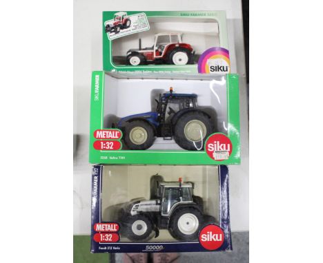 THREE SIKU 1:32 SCALE TRACTOR MODELS TO INCLUDE A LIMITED EDITION FENDT 312 VARIO, A VALTRA T191 AND A STEYR 9094 - ALL AS NE