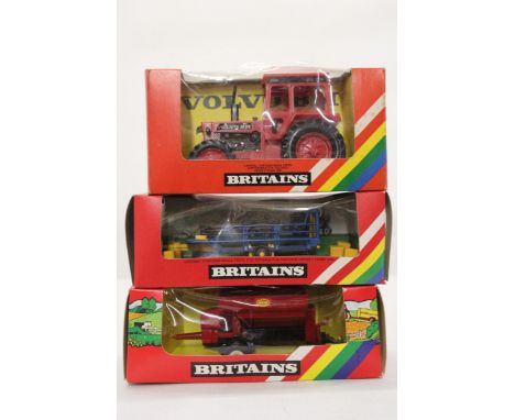 THREE VINTAGE BRITAINS FARM VEHICLES TO INCLUDE A VOLVO TRACTOR, CAT. NO. 9521, A BALE SLEDGE, CAT. NO. 9557 AND A VICON VARI