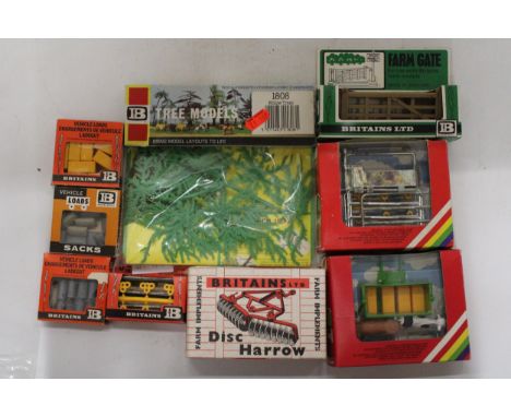 NINE BRITAINS FARMYARD MODEL ACCESSORIES FROM THE 1960'S AND 70'S TO INCLUDE A DISC HARROW, A FARM GATE, ANIMAL/BALE TRANSPOR