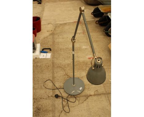 AN INDUSTRIAL STYLE ADJUSTABLE FLOOR LAMP