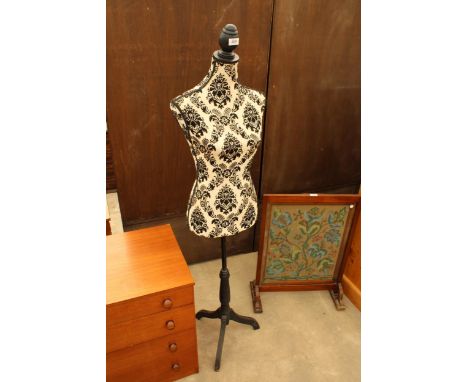 A MANNEQUIN ON TRIPOD BASE