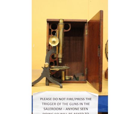 A VINTAGE BRASS MICROSCOPE IN A MAHOGANY CASE
