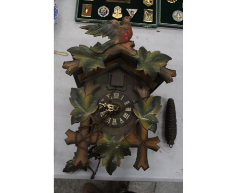 A BLACK FOREST STYLE CUCKOO CLOCK