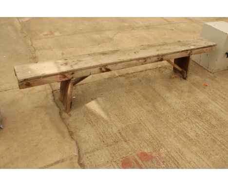 A VINTAGE WOODEN BENCH