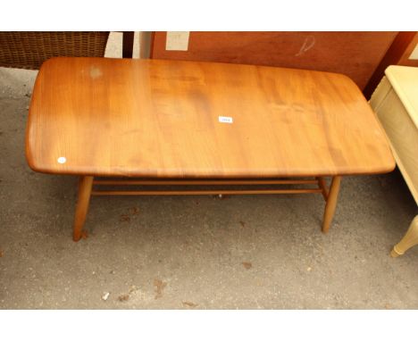 AN ELM ERCOL STYLE COFFEE TABLE WITH MAGAZINE SHELF, 41" X 17.5"