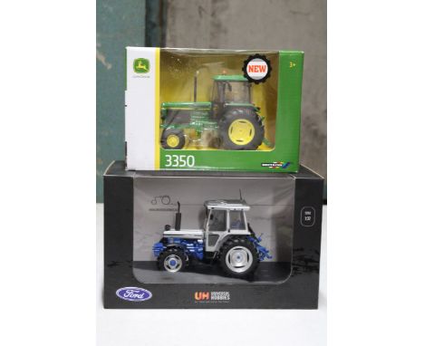 TWO 1/32 SCALE MODELS TO INCLUDE A BRITAINS JOHN DEERE 3350 TRACTOR AND A UNIVERSAL HOBBIES FORD TRACTOR - BOTH AS NEW IN BOX
