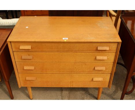 A LIGHT OAK G PLAN E GOMME CHEST OF FOUR GRADUATED DRAWERS, 33.5" WIDE