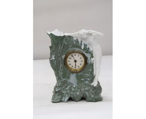 AN ART NOVEAU LADY MANTLE CLOCK