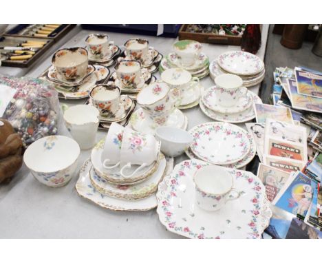 A LARGE QUANTITY OF VINTAGE TEAWARE TO INCLUDE CAKE PLATES, CUPS, SAUCERS, SIDE PLATES, SUGAR BOWLS AND MILK JUGS - SHELLEY, 