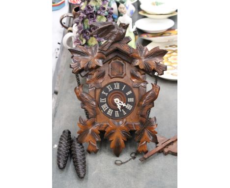 A BLACK FOREST STYLE CUCKOO CLOCK