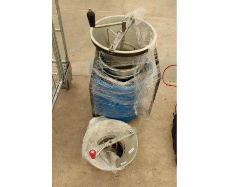 A MANUAL JUICER WITH TWO ATTATCHMENTS