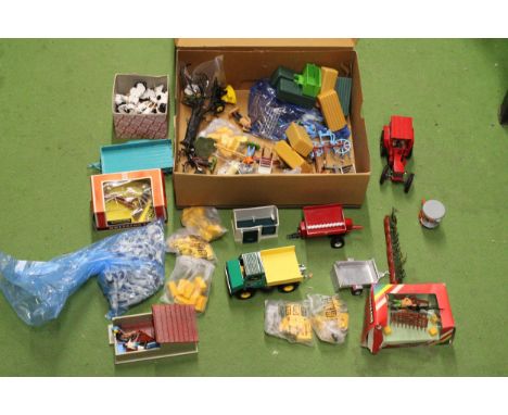 A QUANTITY OF BRITAINS FARMYARD MODELS AND ACCESSORIES TO INCLUDE A TRACTOR, TRAILERS, FARMYARD IMPLEMENTS, SMALL BUILDINGS, 