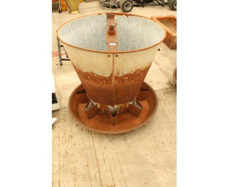 A LARGE GALVANISED AND CAST IRON FEEDER TROUGH PLANTER