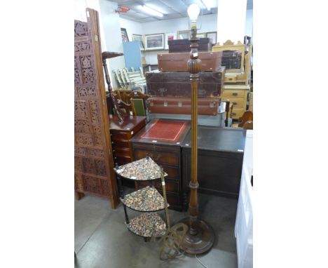 A carved beech standard lamp , a wicker carpet beater and a small corner whatnot 