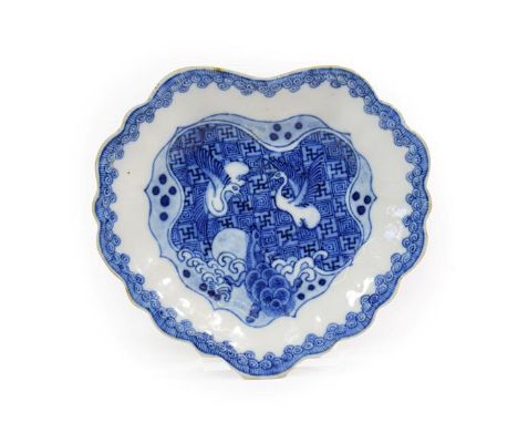 A Chinese Porcelain "Ko-Sometsuke" Dish, mid 17th century, of fluted leaf shape, painted in underglaze blue with birds above 