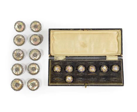 A Set of Seven South Staffordshire Enamel Buttons, circa 1780, circular, each painted with a landscape within gilt heightened