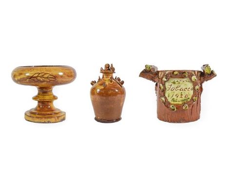 A Buckley Slipware Money Box, late 19th century, of baluster form, applied with hens and chickens on a trailed brown ground, 