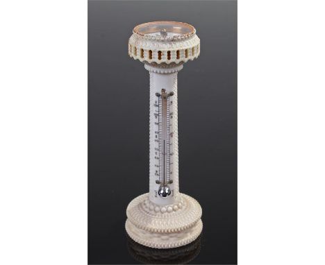 Holtzapffel turned ivory thermometer and compass tower, the enamel compass set under glass, above a carved tower with mercury