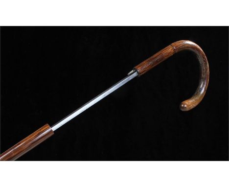 Early 20th Century Toledo sword stick, the faux bamboo cane with steel Toledo signed blade, 93cm long, together with a Far Ea