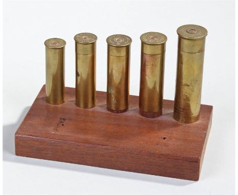 Kynoch's shotgun cartridge display, with No 8 gauge, 10, 12, 16 and 20 on a mahogany display stand 