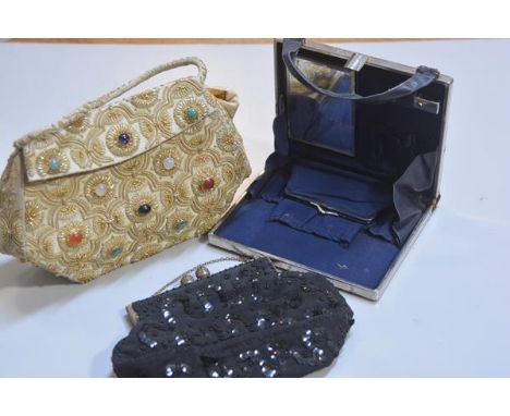 A 1950s beaded evening bag, a silk gold and silver thread evening bag and a 1930s chrome mounted lady's blue leather evening 